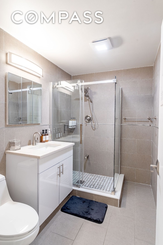 212 E 70th St Unit B, New York City, NY 10021 - full bath featuring vanity, a stall shower, and tile patterned floors