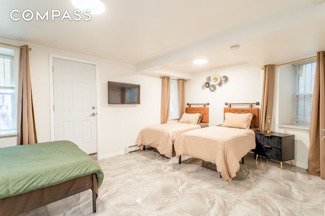212 E 70th St Unit B, New York City, NY 10021 - bedroom featuring baseboard heating and light marble finish floors