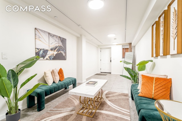 212 E 70th St Unit B, New York City, NY 10021 - tiled living area featuring baseboards