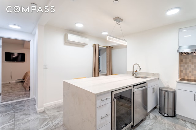 212 E 70th St Unit B, New York City, NY 10021 - kitchen featuring beverage cooler, dishwasher, a wall mounted air conditioner, light marble finish floors, and a peninsula