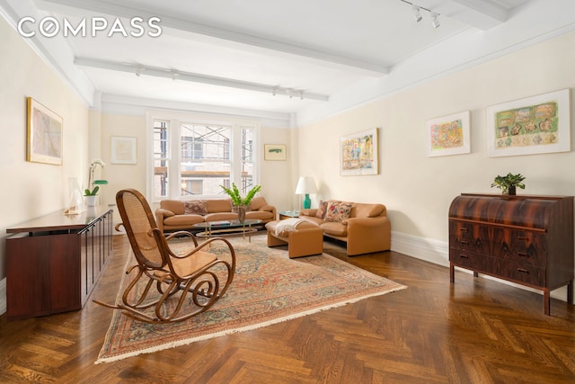 103 E 84th St Unit 5B, New York City, NY 10028 - living area with rail lighting, baseboards, and beamed ceiling