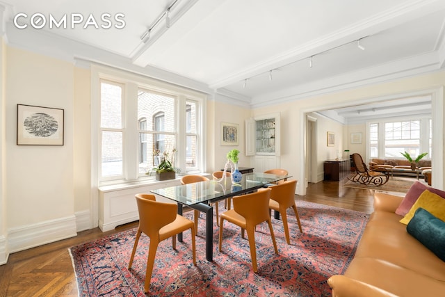 103 E 84th St Unit 5B, New York City, NY 10028 - dining area featuring rail lighting and crown molding