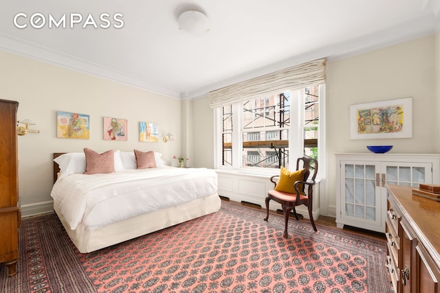 103 E 84th St Unit 5B, New York City, NY 10028 - bedroom featuring crown molding, wood finished floors, and baseboards