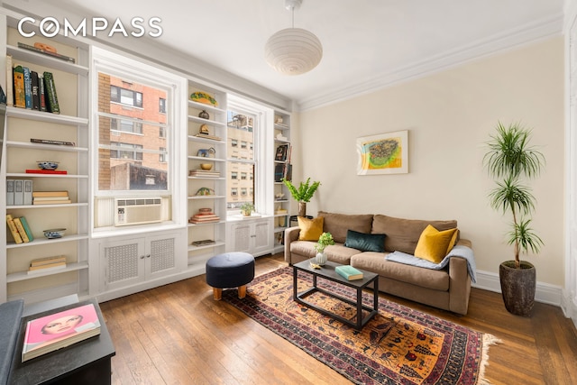 103 E 84th St Unit 5B, New York City, NY 10028 - sitting room with hardwood / wood-style flooring, ornamental molding, cooling unit, and baseboards