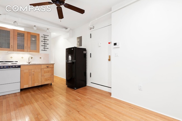 140 W 10th St Bte, Unit Bte, New York City, NY 10014 - kitchen with freestanding refrigerator, electric range, light brown cabinetry, light wood finished floors, and ceiling fan