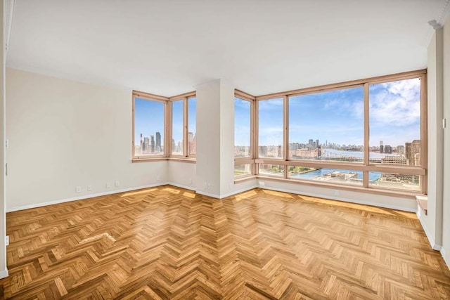 524 E 72nd St Unit 37Ab, New York City, NY 10021 - unfurnished room featuring a view of skyline, baseboards, and a water view