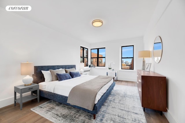 3000 Valentine Ave Unit 2B, New York City, NY 10458 - bedroom with wood finished floors and baseboards