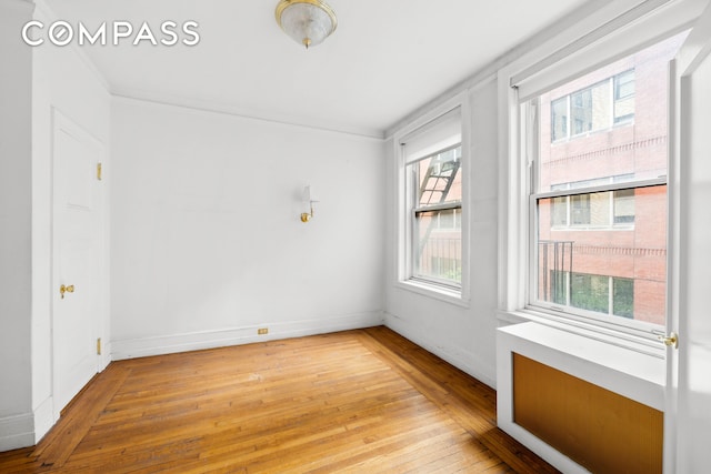50 W 67th St Unit 4E, New York City, NY 10023 - unfurnished room with light wood-style floors and baseboards