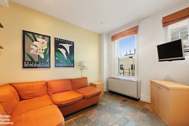 155 E 72nd St Unit 11/12A, New York City, NY 10021 - living room with stone tile floors and baseboards