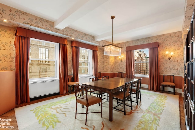 155 E 72nd St Unit 11/12A, New York City, NY 10021 - dining area featuring wallpapered walls, a wainscoted wall, beam ceiling, and a chandelier
