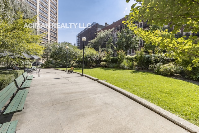 301 W 110th St Unit 6A, New York City, NY 10026 - view of community with a lawn
