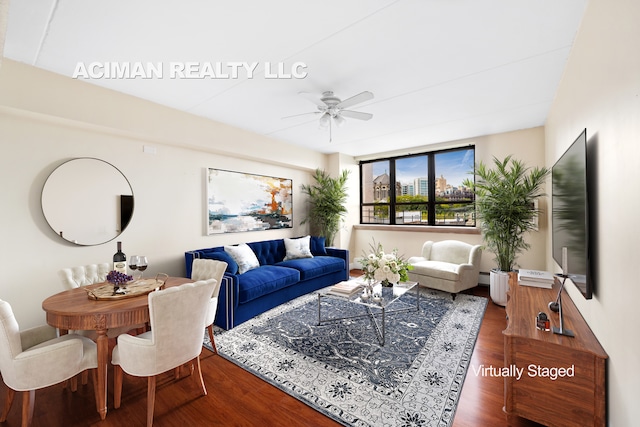 301 W 110th St Unit 6A, New York City, NY 10026 - living area featuring a ceiling fan, wood finished floors, and a baseboard heating unit