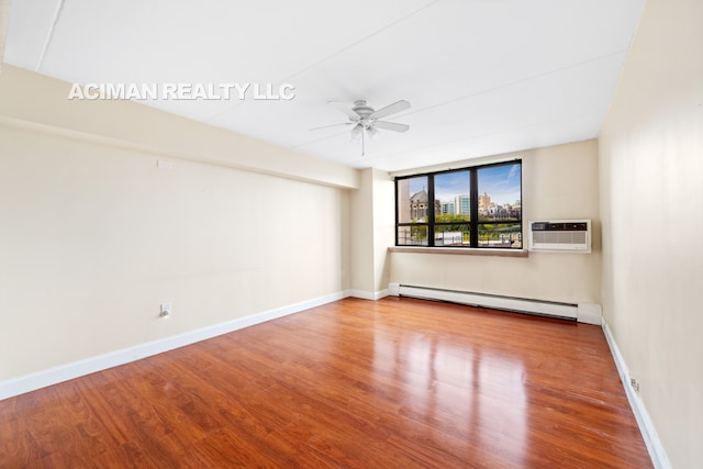 301 W 110th St Unit 6A, New York City, NY 10026 - unfurnished room with a baseboard heating unit, ceiling fan, wood finished floors, and a wall mounted AC
