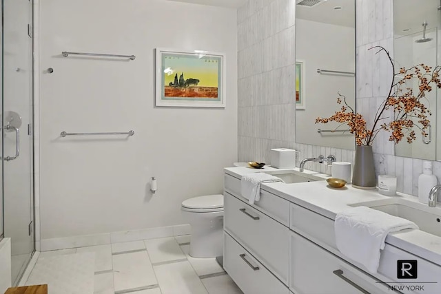 160 E 22nd St Unit 18-A, New York City, NY 10010 - full bathroom featuring a shower stall, tile walls, toilet, vanity, and baseboards