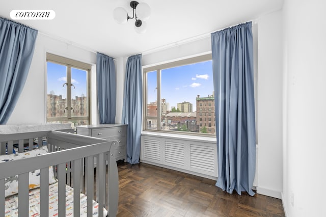 60 Remsen St Unit 9A, New York City, NY 11201 - bedroom featuring multiple windows, a crib, and a view of city