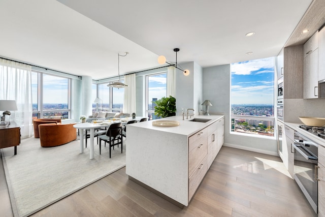 1 City Pt Unit 59E, New York City, NY 11201 - kitchen with modern cabinets, appliances with stainless steel finishes, a peninsula, healthy amount of natural light, and recessed lighting