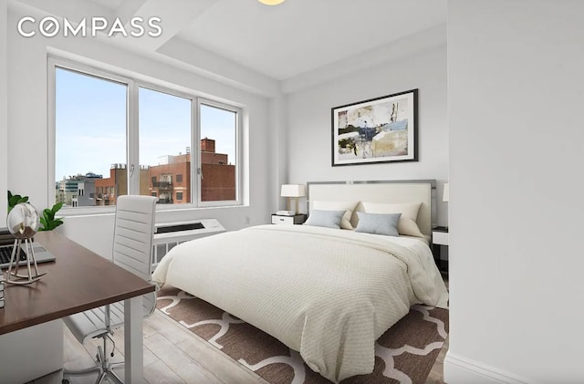 28-20 Astoria Blvd Unit 4, New York City, NY 11102 - bedroom with wood finished floors and an office area