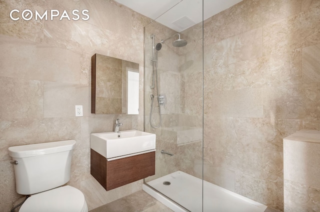 28-20 Astoria Blvd Unit 4, New York City, NY 11102 - bathroom with tile walls, vanity, and walk in shower