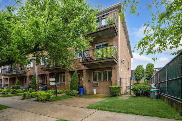 2256 Hendrickson St Unit P1, New York City, NY 11234 - view of front facade with a balcony and brick siding