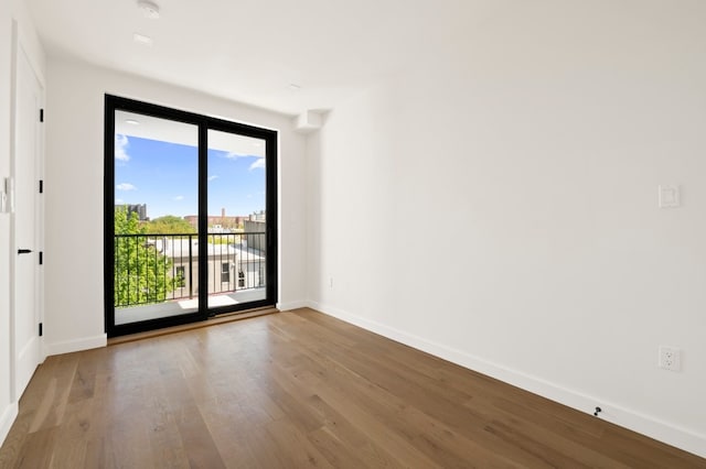 78 Harman St Unit 2-R, New York City, NY 11221 - spare room featuring wood finished floors and baseboards