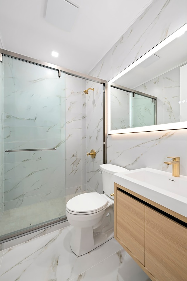 78 Harman St Unit 2-F, New York City, NY 11221 - bathroom with marble finish floors, vanity, a marble finish shower, and tile walls