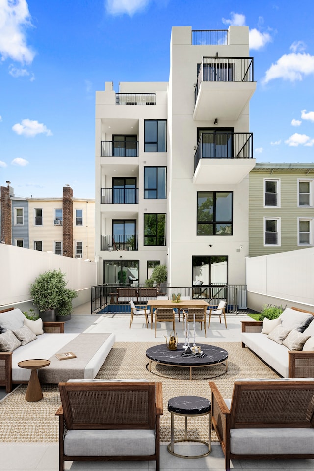 78 Harman St Unit 2-F, New York City, NY 11221 - view of patio / terrace featuring an outdoor living space with a fire pit