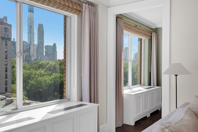 3 E 71st St Unit 10/11B, New York City, NY 10021 - bedroom featuring a view of skyline and crown molding