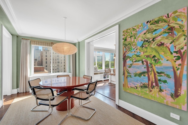 3 E 71st St Unit 10/11B, New York City, NY 10021 - dining room featuring dark wood-type flooring, baseboards, and crown molding