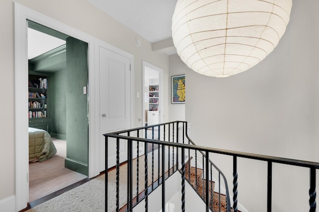 3 E 71st St Unit 10/11B, New York City, NY 10021 - hall featuring an upstairs landing, wood finished floors, and baseboards