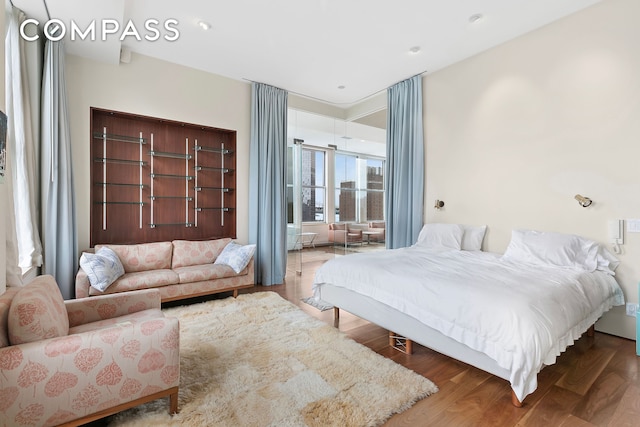 175 E Broadway Unit 8B, New York City, NY 10002 - bedroom featuring wood finished floors