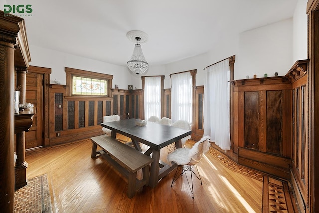 685 E 22nd St, New York City, NY 11210 - dining space with light wood-style flooring and a chandelier
