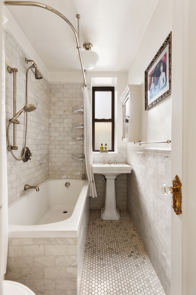 74 W 68th St Unit 7F, New York City, NY 10023 - full bath featuring tiled shower / bath combo, tile walls, and tile patterned floors
