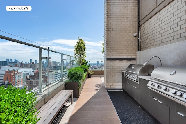 280 Park Ave S Unit 18Ef, New York City, NY 10010 - view of patio / terrace with a skyline view, a grill, and a balcony