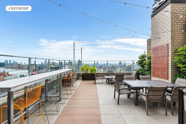 280 Park Ave S Unit 18Ef, New York City, NY 10010 - view of patio / terrace with a skyline view and outdoor dining space