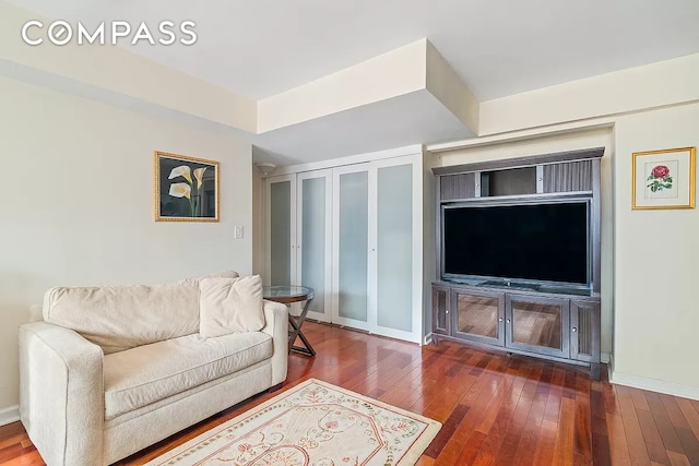 153 E 57th St Unit 17F, New York City, NY 10022 - living area featuring hardwood / wood-style flooring and baseboards