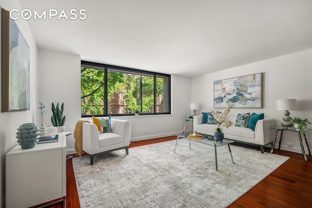 386 Columbus Ave Unit 2A, New York City, NY 10024 - living area with dark wood-style floors and baseboards