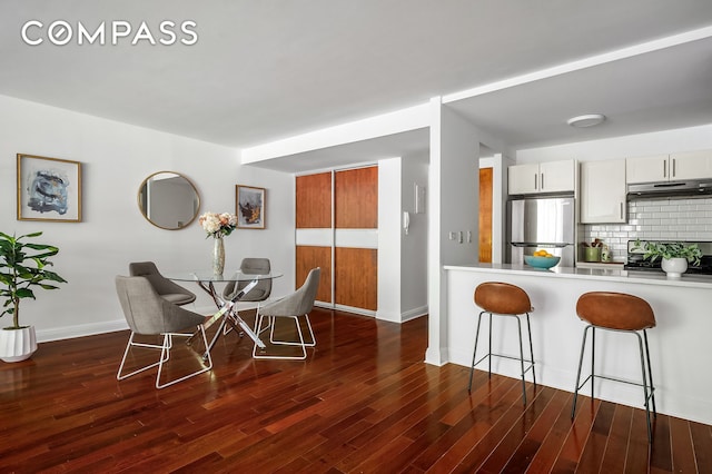 386 Columbus Ave Unit 2A, New York City, NY 10024 - dining area with baseboards and dark wood-style floors