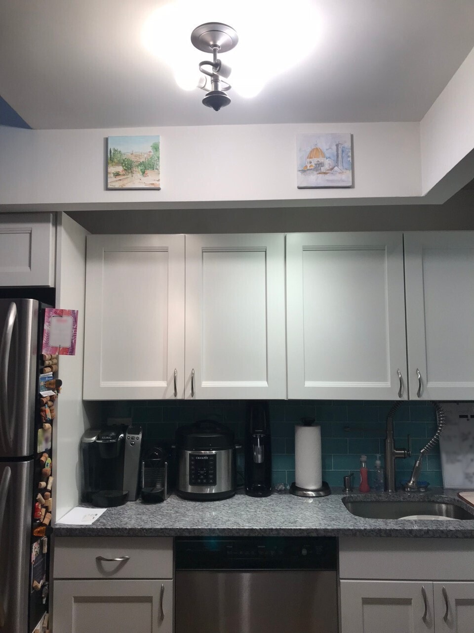 225 E 86th St Unit 304, New York City, NY 10028 - kitchen with stainless steel appliances, a sink, and backsplash