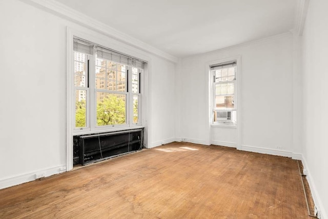 150 E 72nd St Unit 6S, New York City, NY 10021 - empty room with ornamental molding, wood finished floors, and baseboards
