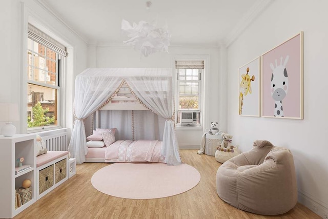 150 E 72nd St Unit 6S, New York City, NY 10021 - bedroom featuring crown molding and wood finished floors