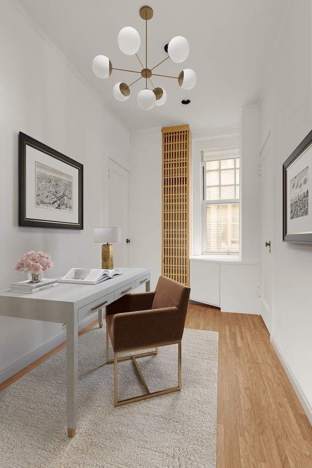 150 E 72nd St Unit 6S, New York City, NY 10021 - office area with light wood-style floors, a chandelier, and ornamental molding