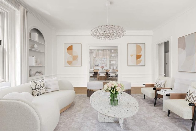 150 E 72nd St Unit 6S, New York City, NY 10021 - living room featuring built in features, crown molding, a decorative wall, wainscoting, and wood finished floors