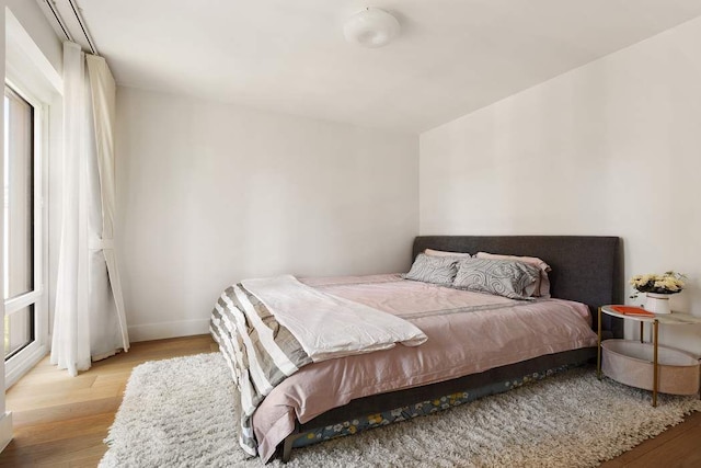 15 W 61st St Unit 12G, New York City, NY 10023 - bedroom featuring wood finished floors and baseboards