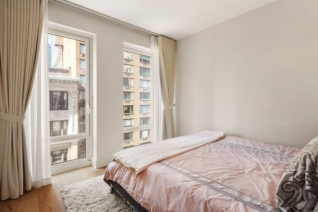 15 W 61st St Unit 12G, New York City, NY 10023 - bedroom featuring light wood-style flooring