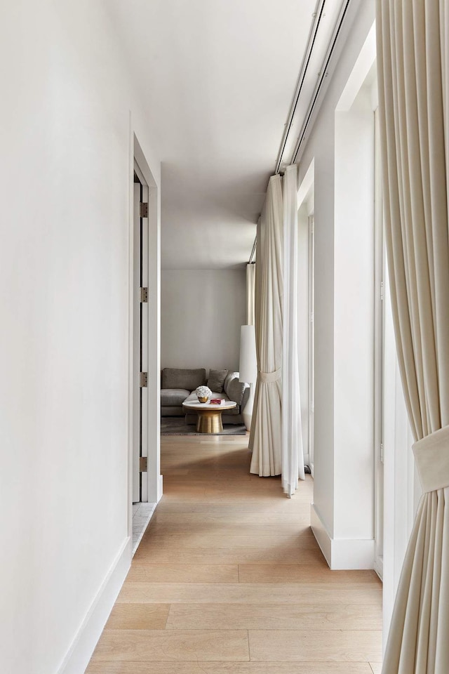 15 W 61st St Unit 12G, New York City, NY 10023 - hall featuring wood finished floors and baseboards