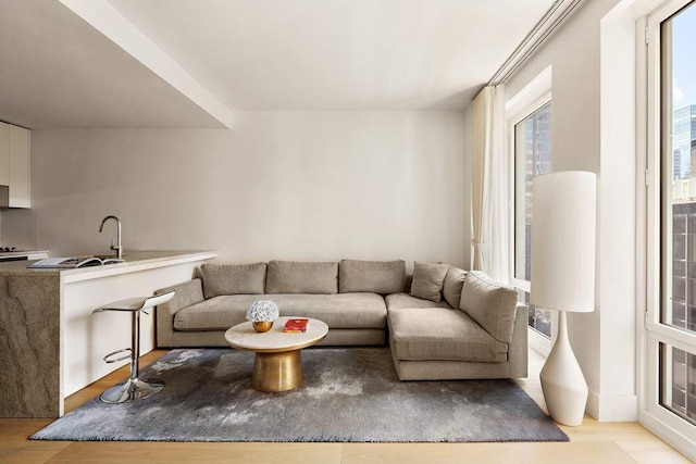 15 W 61st St Unit 12G, New York City, NY 10023 - living room featuring light wood-type flooring and plenty of natural light