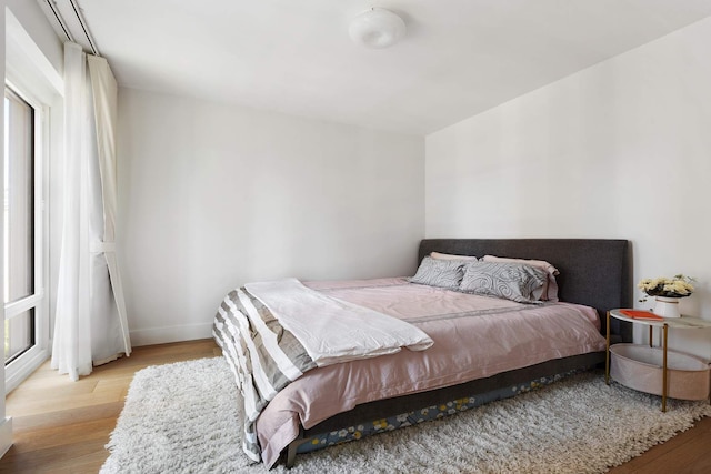 15 W 61st St Unit 12G, New York City, NY 10023 - bedroom featuring wood finished floors and baseboards
