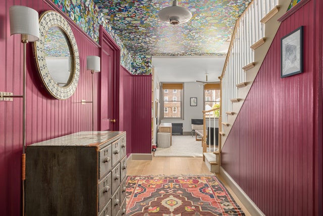 15 Jones St Unit 6A, New York City, NY 10014 - foyer featuring wallpapered walls, wood finished floors, stairs, and baseboards