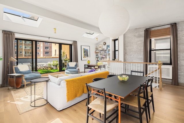 15 Jones St Unit 6A, New York City, NY 10014 - living room with a skylight, light wood finished floors, and brick wall