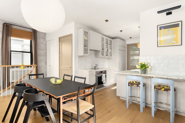 15 Jones St Unit 6A, New York City, NY 10014 - dining area with light wood-style flooring